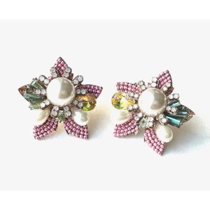 A pair of E2110 earrings with pearls and crystals.