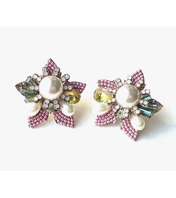 A pair of E2110 earrings with pearls and crystals.