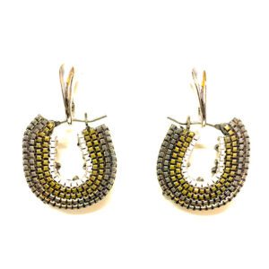 A pair of E2108 earrings with gold and silver beading.