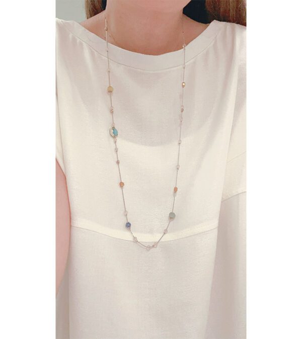 A woman wearing a white shirt and the NK8901 (Multi/ Light) necklace.