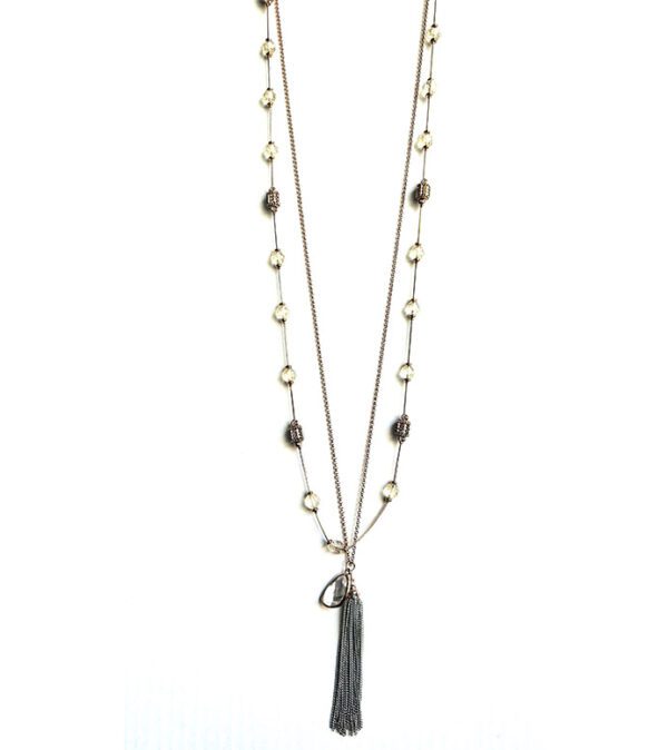 A long necklace with NK8895 and beads.