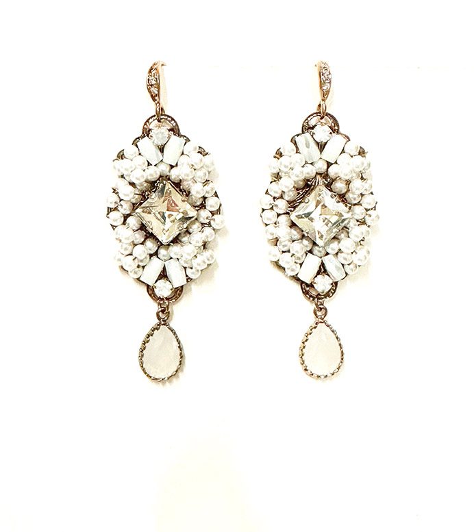 A pair of E2062 earrings with white stones and crystals.