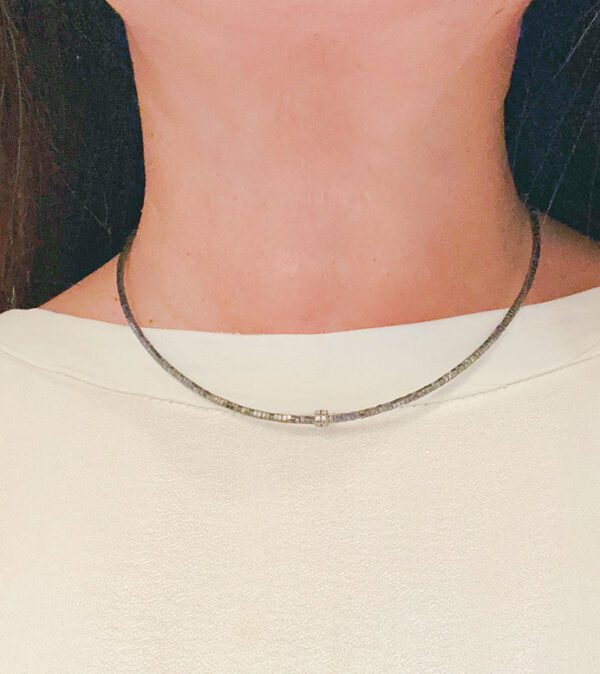 A close up of a woman's neck with an NK5115 (Black) necklace.