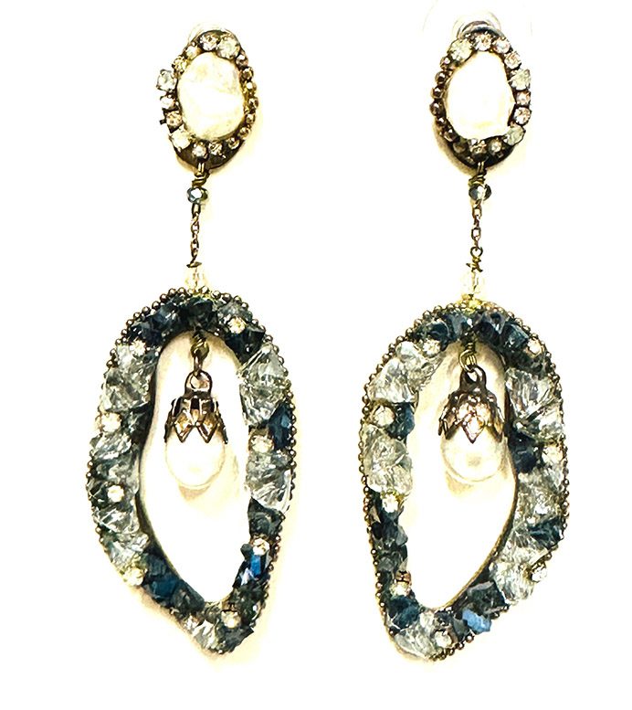 A pair of E2015 earrings with blue stones and pearls.