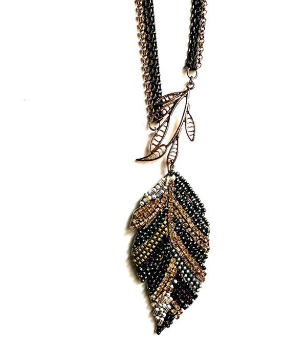 A black and gold leaf NK4577(Multi) necklace on a chain.