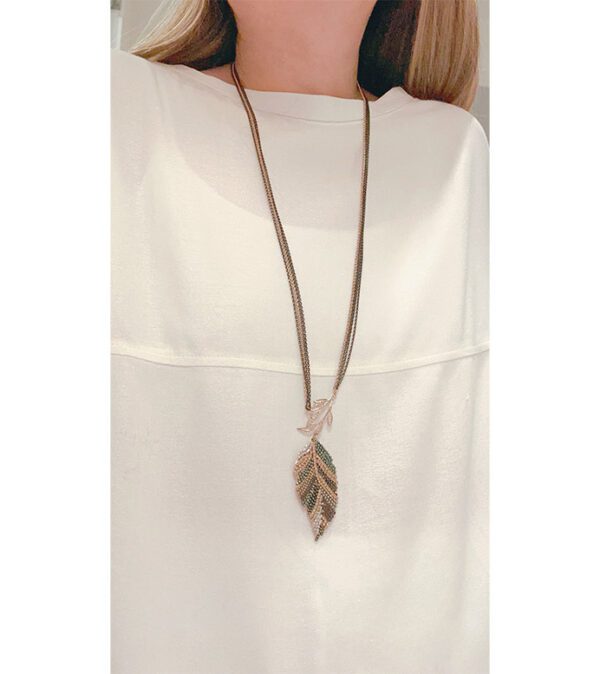 A woman is wearing the NK4577(Multi) necklace.