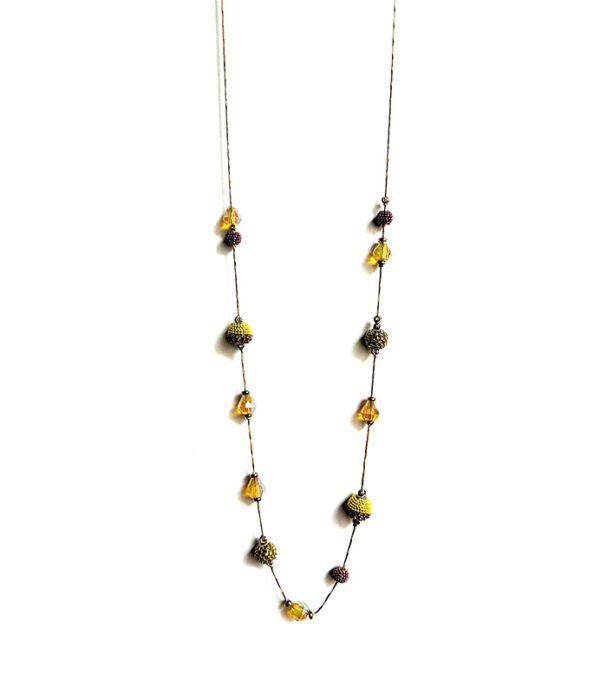 A NK2072 (Multi) necklace with yellow and brown glass beads.