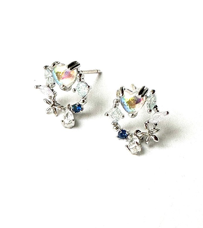 A pair of earrings with blue crystals and E0742 crystals.