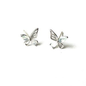 A pair of E0741 stud earrings on a white surface.