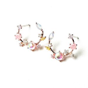 A pair of pink and white E0739 hoop earrings with crystals.