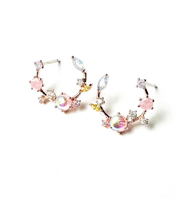 A pair of pink and white E0739 hoop earrings with crystals.