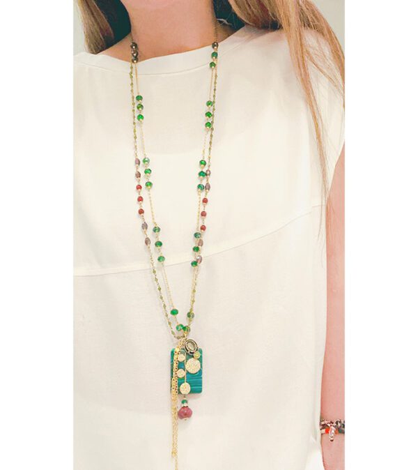 A woman wearing the NK1493 necklace with beads and tassels.