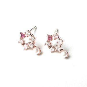 A pair of E0735 stud earrings on a white surface.