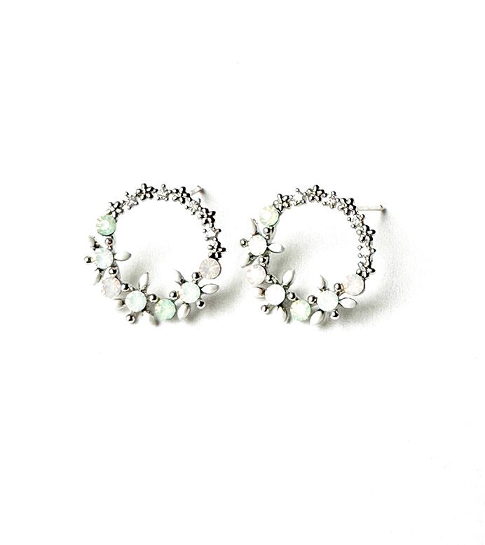 A pair of E0734 hoop earrings with green stones.