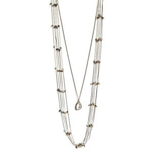 A NK333 necklace with silver beads and a pendant.