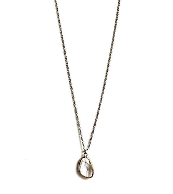 A necklace with a NK333 pendant on a chain.