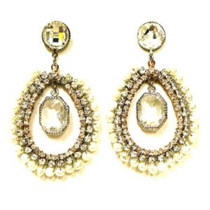 A pair of E726101 earrings with pearls and crystals.