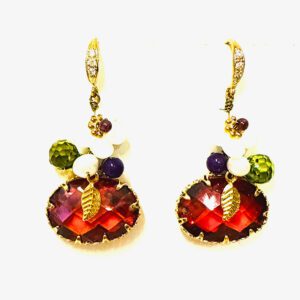 A pair of E00409 (Ruby) earrings with red and green stones.