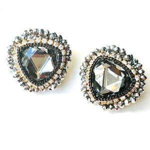 A pair of E81154 earrings with black crystals and beading.