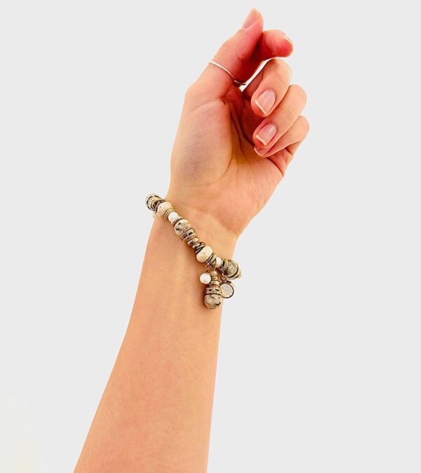 A woman's hand with a B9164 bracelet on it.