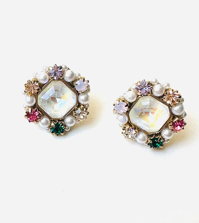 A pair of E9125 (White Opal) earrings with colorful stones and pearls.