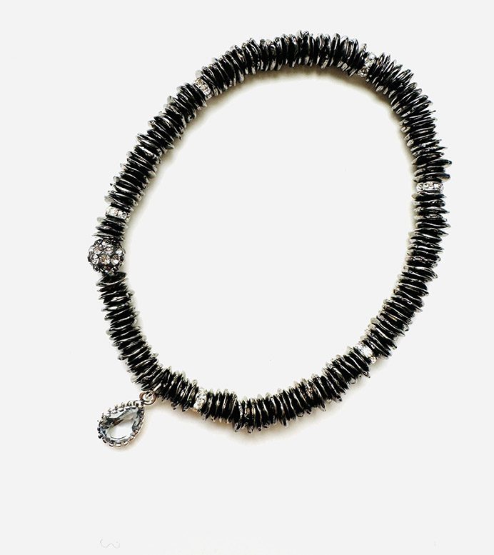 A black beaded bracelet with a silver charm called B5098.