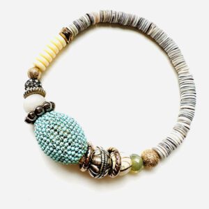 A B3203 with turquoise beads and silver charms.