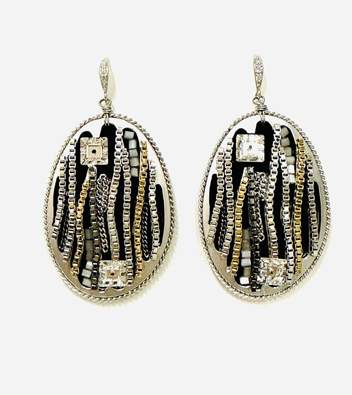 E8652, a pair of earrings with silver and gold accents.