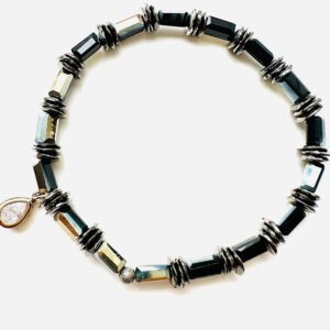 A B1010 with black beads and silver charms.