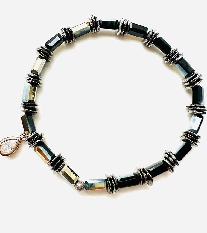 A B1010 with black beads and silver charms.
