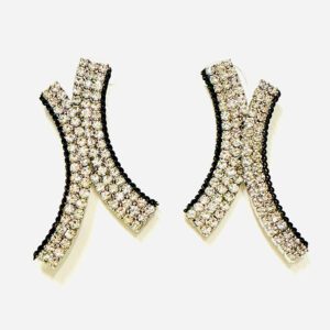 A pair of E8501 earrings with black and white rhinestones.