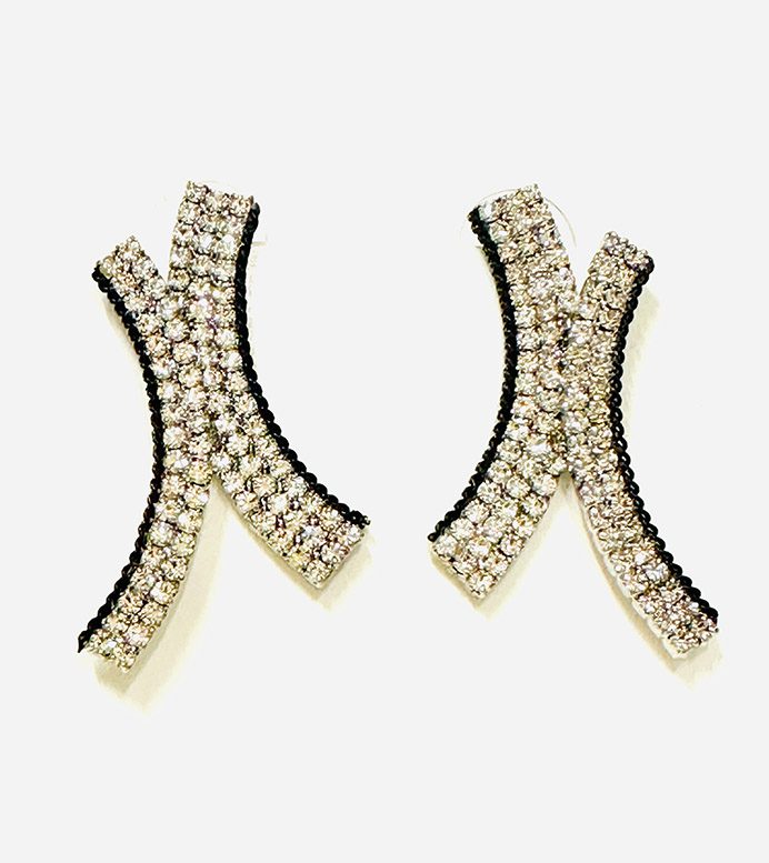 A pair of E8501 earrings with black and white rhinestones.