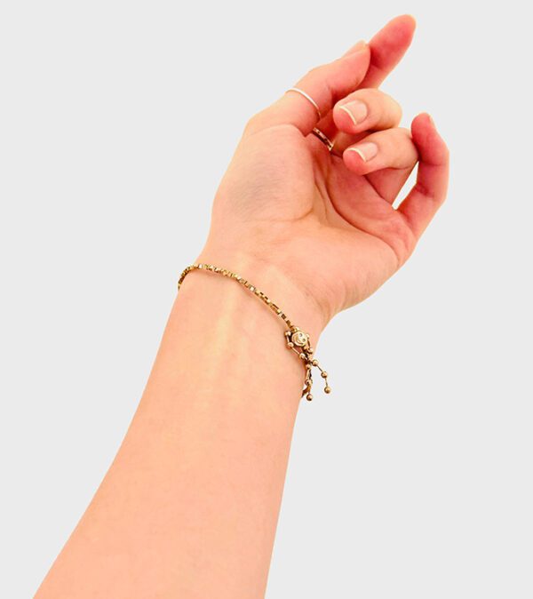 A woman's hand with a B208 bracelet on it.