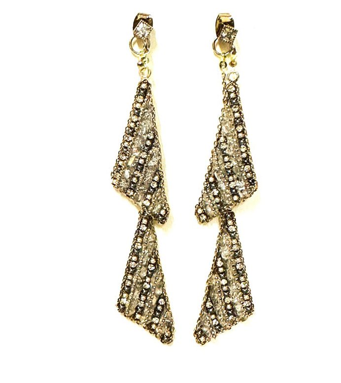 A pair of E5014 earrings with diamonds.