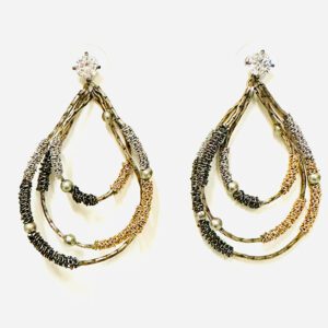 A pair of E5008 earrings with gold, silver and black beads.