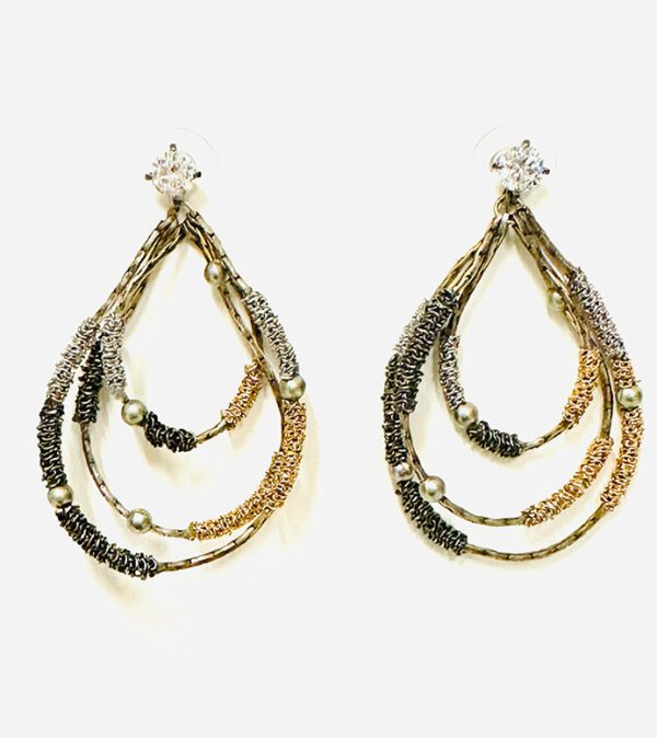 A pair of E5008 earrings with gold, silver and black beads.