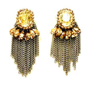 A pair of E4106 earrings with gold chains and crystals.