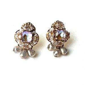 A pair of E2488 (Opal) earrings with crystals and rhinestones.