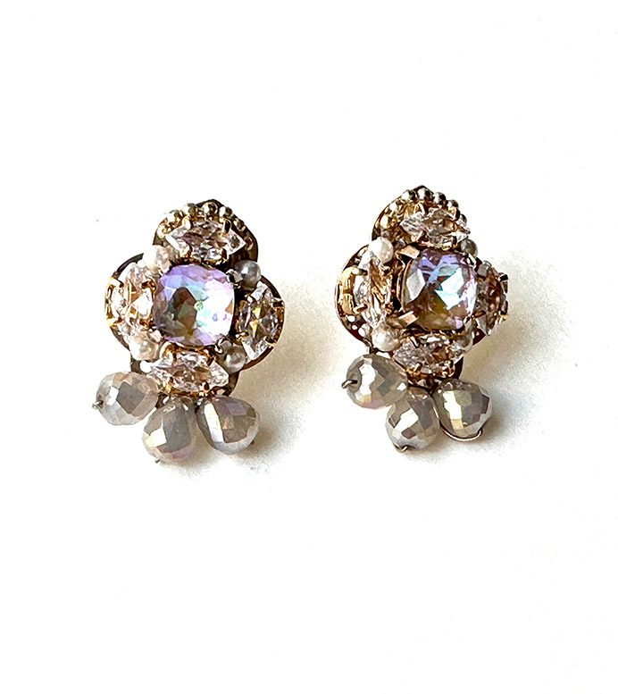 A pair of E2488 (Opal) earrings with crystals and rhinestones.