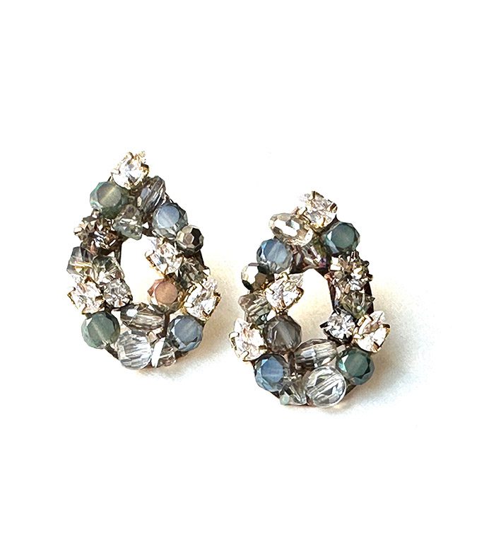 A pair of E2485 with blue stones and crystals.