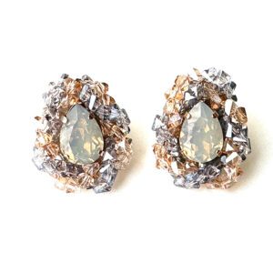 A pair of E2413 earrings with opal stones and rhinestones.