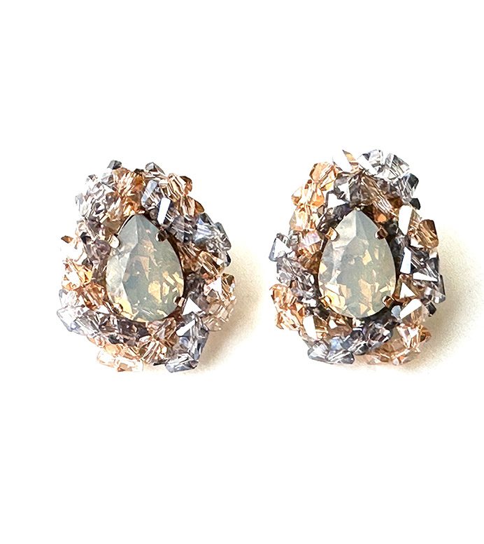 A pair of E2413 earrings with opal stones and rhinestones.