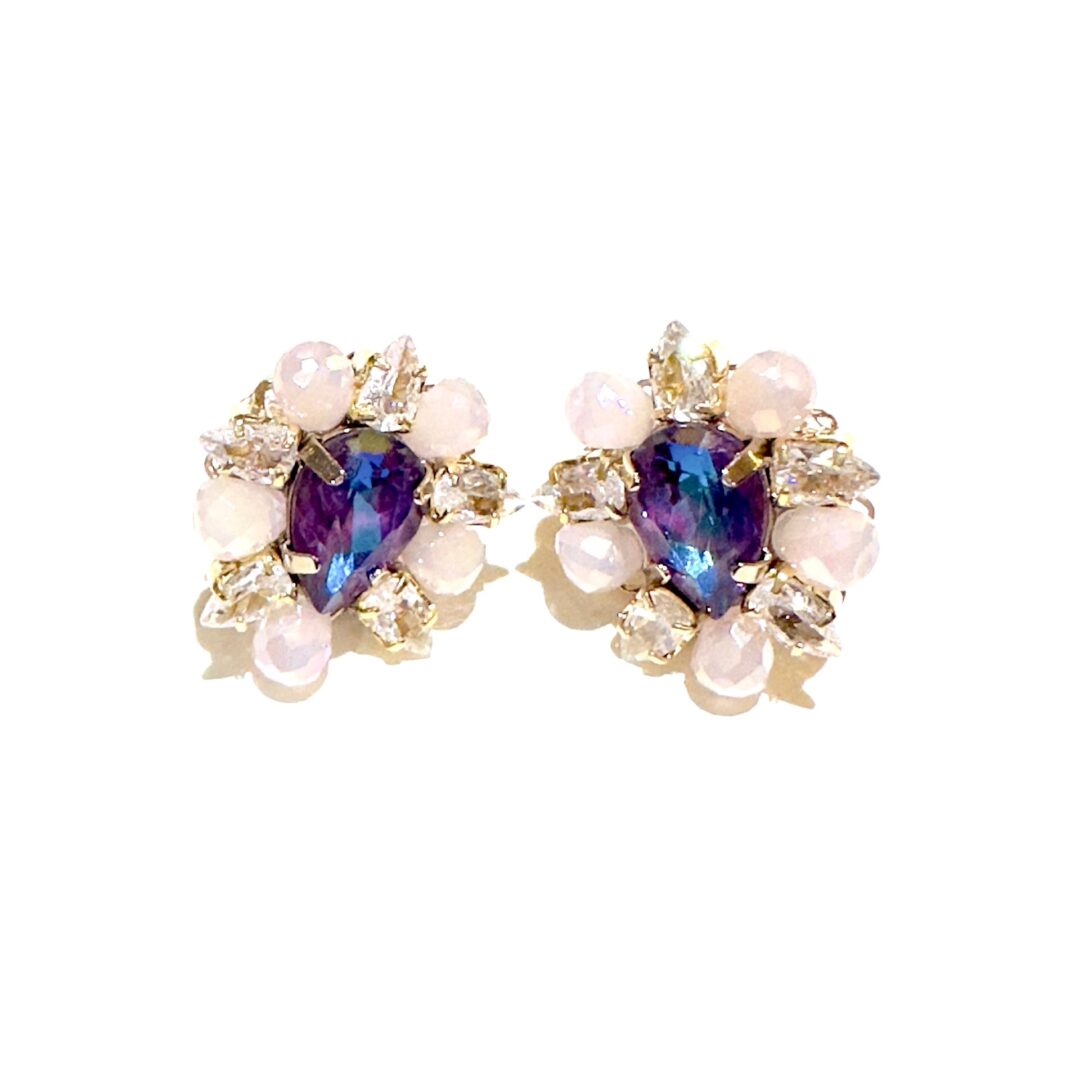 A pair of E2481 (Holiday) earrings with pearls.