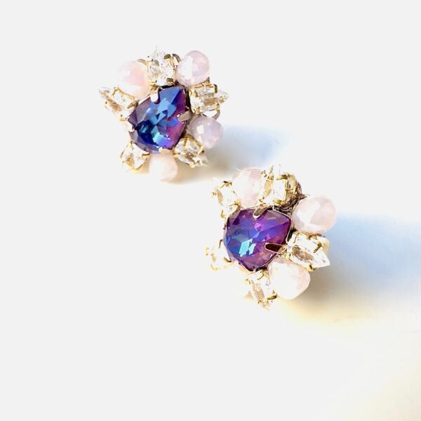 A pair of E2481 (Holiday) earrings with purple and pink crystals.