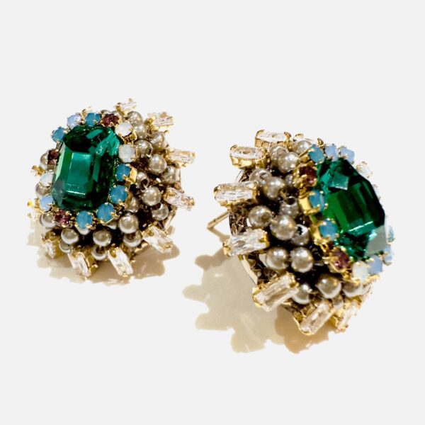 A pair of E24812 (Holiday) earrings with emerald stones and pearls.