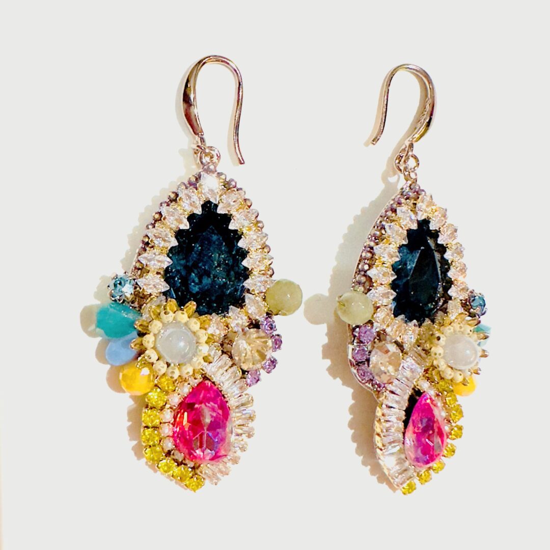 A pair of E5017 (Holiday) earrings with colorful stones and crystals.