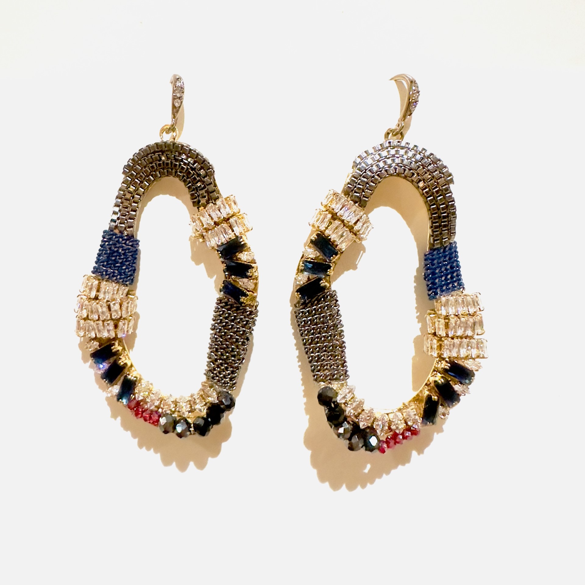A pair of E5018 (Holiday) earrings with multi colored beads.