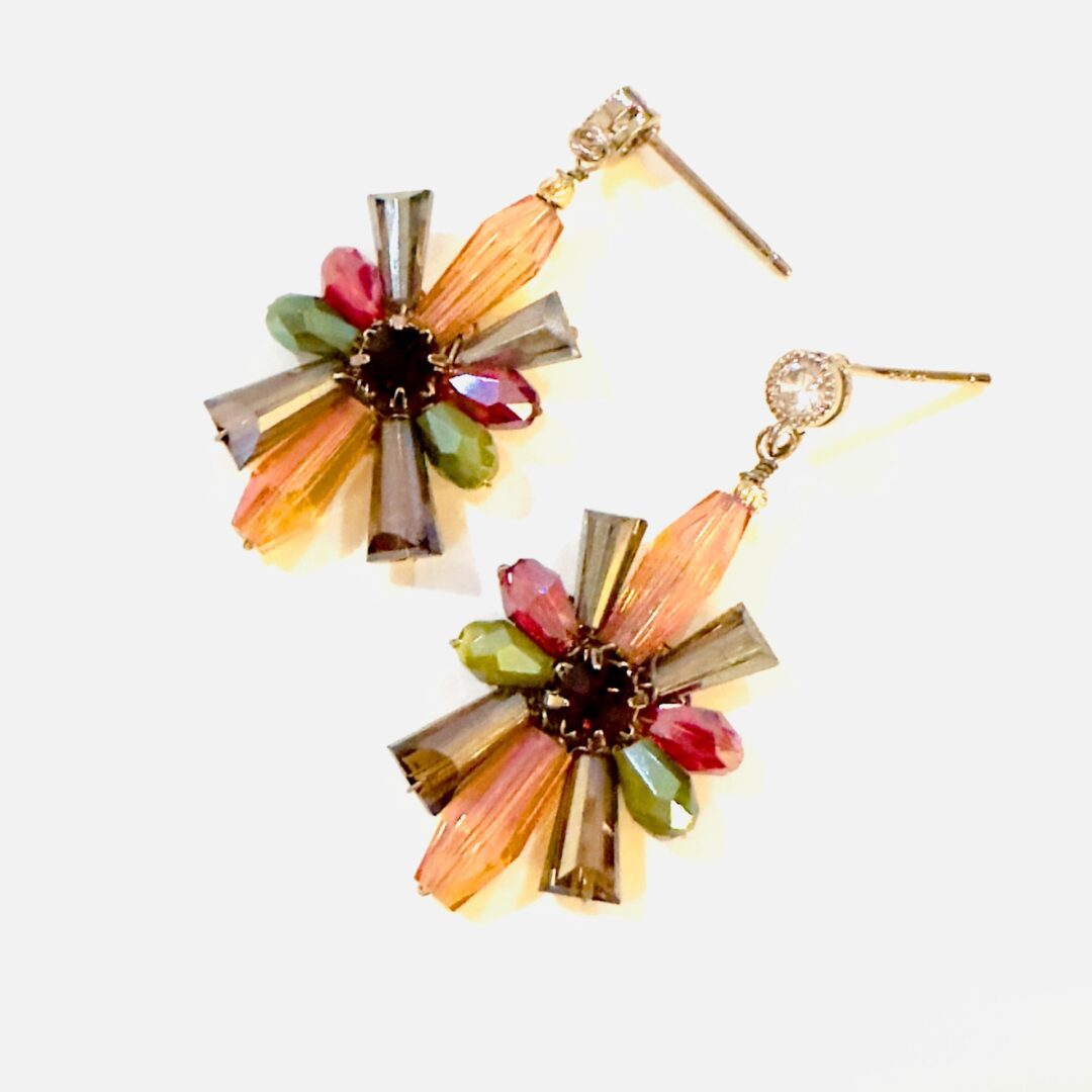 A pair of E5019 (Holiday) earrings with multi colored beads.