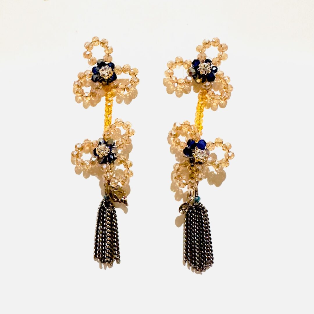 A pair of E5020 (Holiday) earrings with beads and tassels.