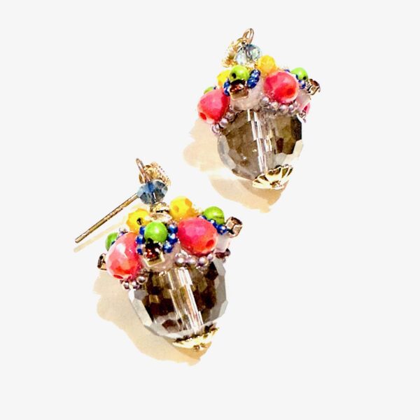 A pair of E5021 (Holiday) with colorful beads on them.